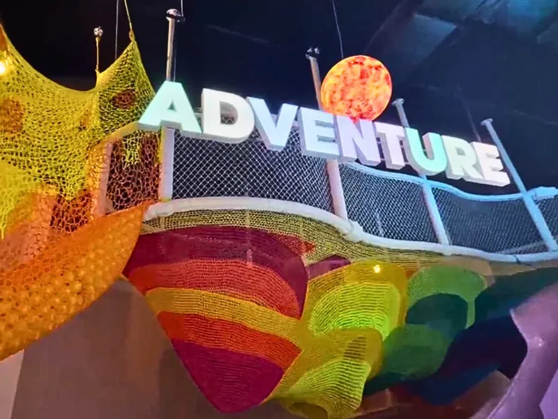 Rope bridges and padded climbers at UFOREA's Adventure Trails zone