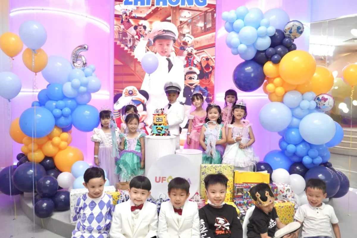 Young guests in princess and captain costumes at a themed birthday party at UFOREA Penang