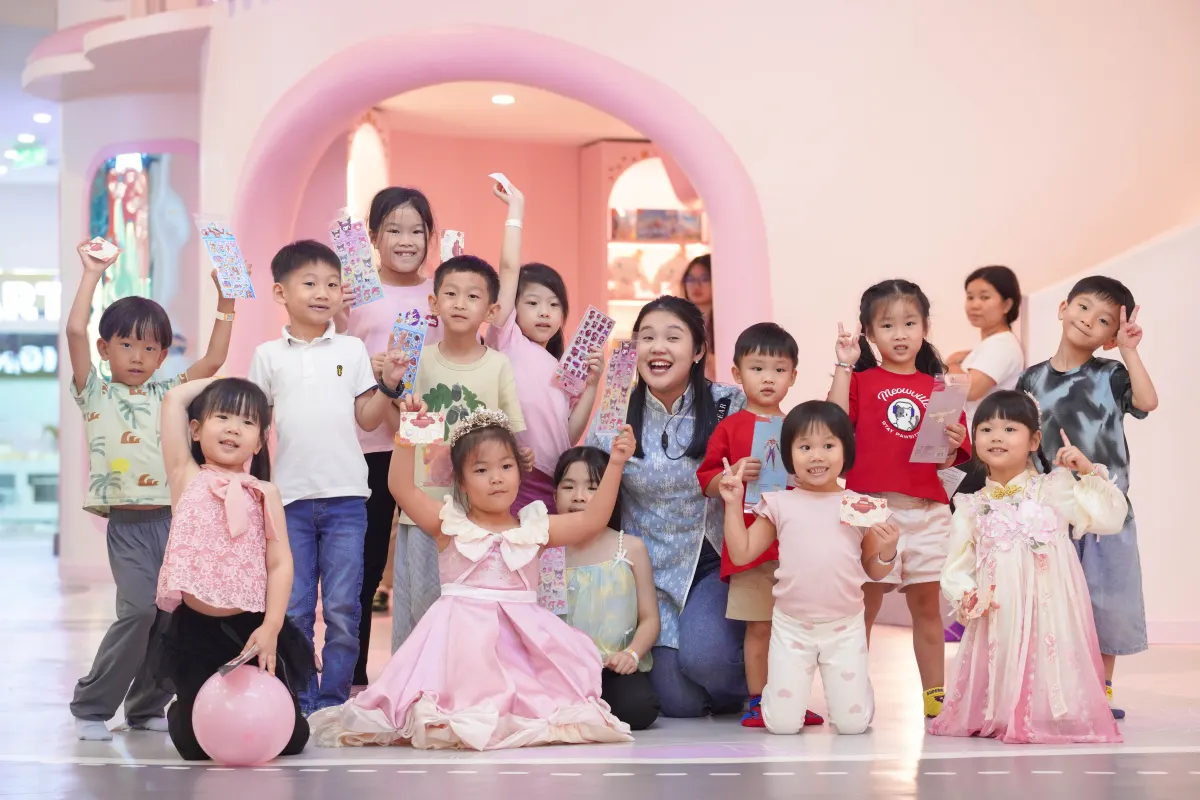 Children showing off their sticker prizes after a craft workshop at UFOREA Penang