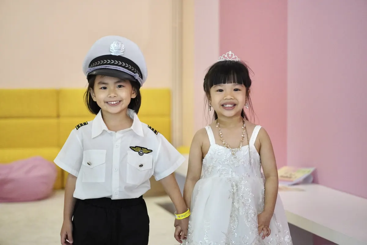 Two young friends dressed as a ship captain and a princess at the UFOREA Penang Makeover castle
