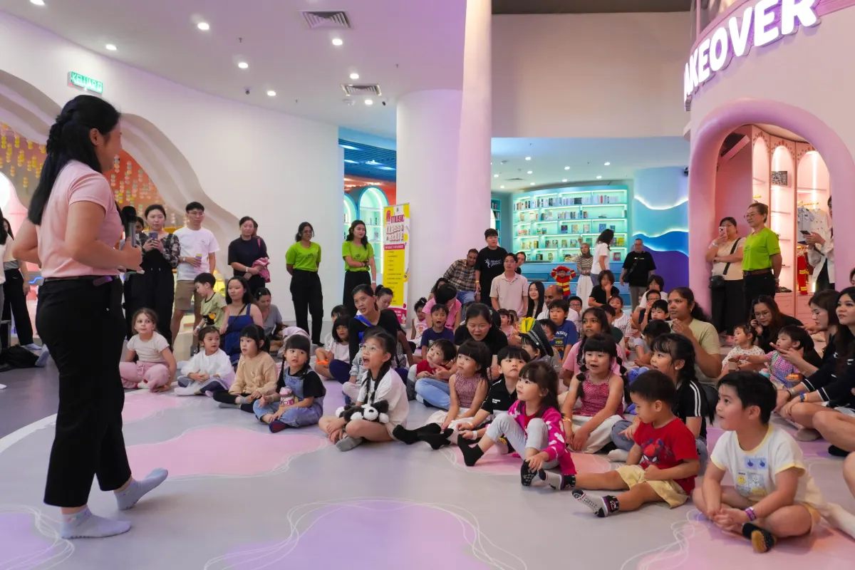 Families gathered for storytime in front of the Makeover castle at UFOREA Penang