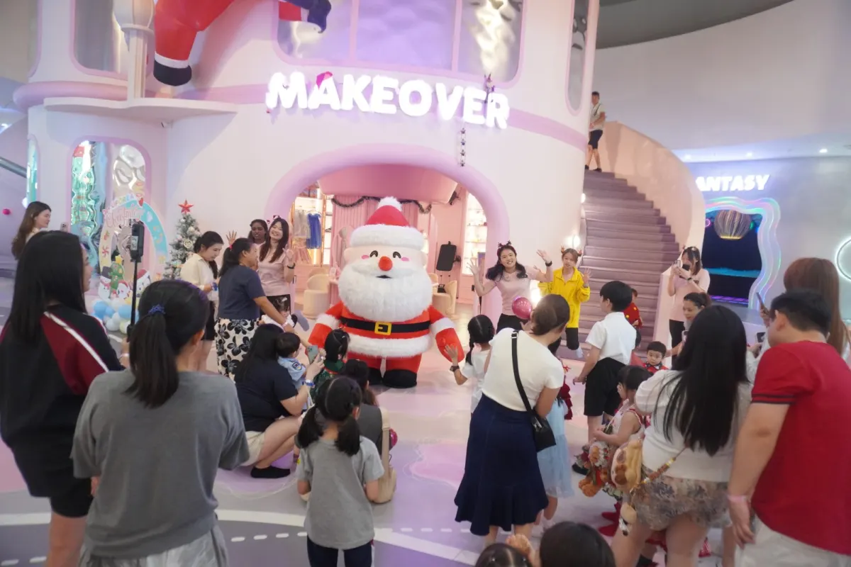 A Santa mascot greeting families at the Makeover castle during a UFOREA Penang Christmas event